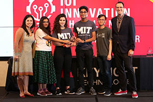 From left Marie Hattar, Keysight CMO, with students from the Massachusetts Institute of Technology who won the Special Prize, The Keysight Diversity in Tech Award for their Smart Land entry, berrySmart, and Daniel Bogdanoff, master of ceremonies for Keysight.