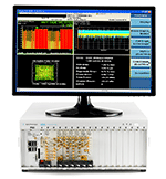 M9391A PXIe Vector Signal Analyzer and M9381A PXIe Vector Signal Generator in M9018A 18 Slot PXIe Chassis with M9036A PXIe Embedded Controller. X-Series Measurement Application for WCDMA is shown on the monitor.